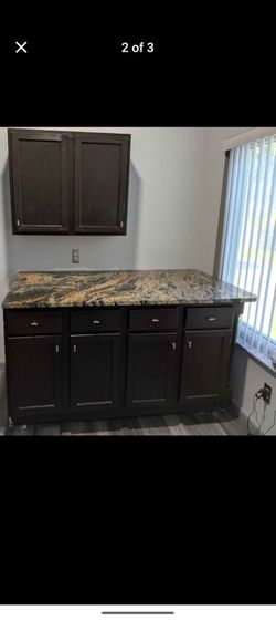 Espresso finished cabinets and granite countertop