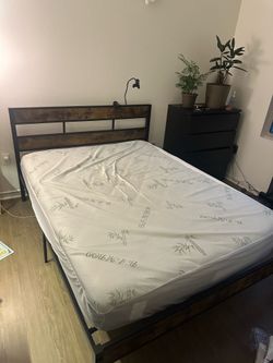 Queen bed frame and mattress. Great condition !