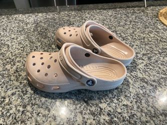 Pink crocs.