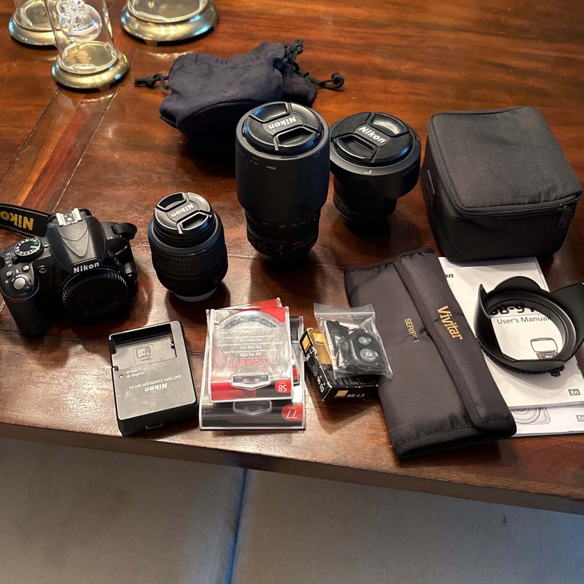 Nikon D3100 Digital Camera With 3 Lenses And A Flash