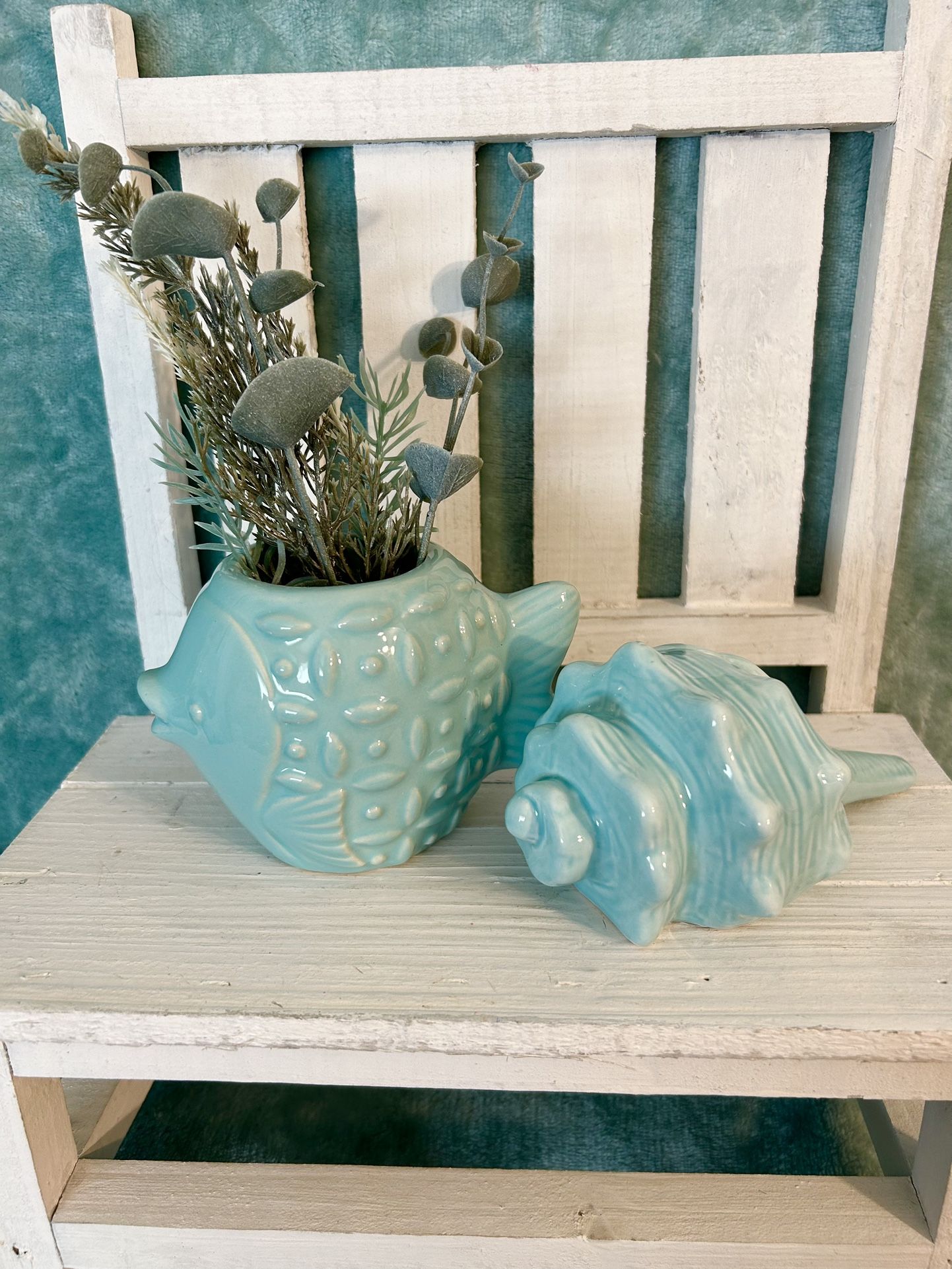 beach bathroom decor. Fish vase & blue conch seashell