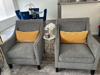 Gray arm chairs with nailhead trim