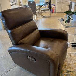 Brown leather dual power recliner armchair.