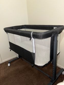 Gray bedside bassinet