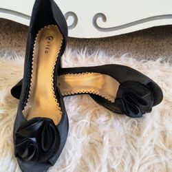 Elegant peep toe black heels with beautiful fabric rose in the front- Excellent condition. Size 7.5