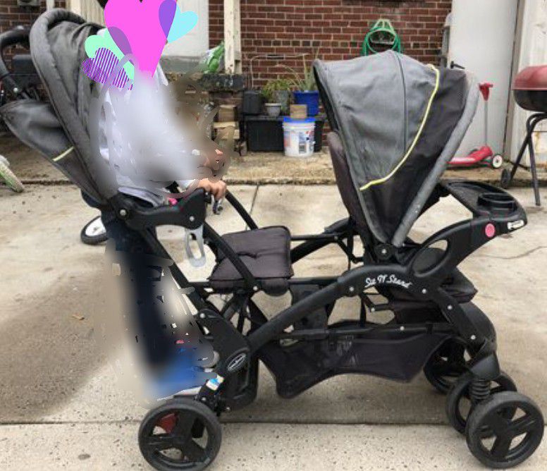 Baby sit and stand stroller