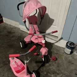 Radio Flyer 4 in 1 Stroll N Trike Adjustable Stroller Tricycle, Pink with pink scooter 