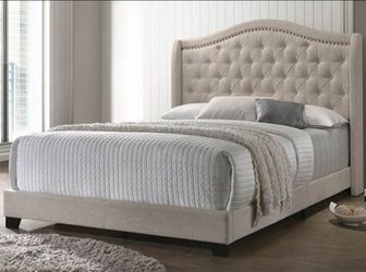 Beige arched queen bed