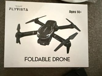 NEW FlyVista Foldable Drone   Foldable FlyVista drone with an HD FPV camera. This black quadcopter has 360-degree flip capability, headless mode, and 