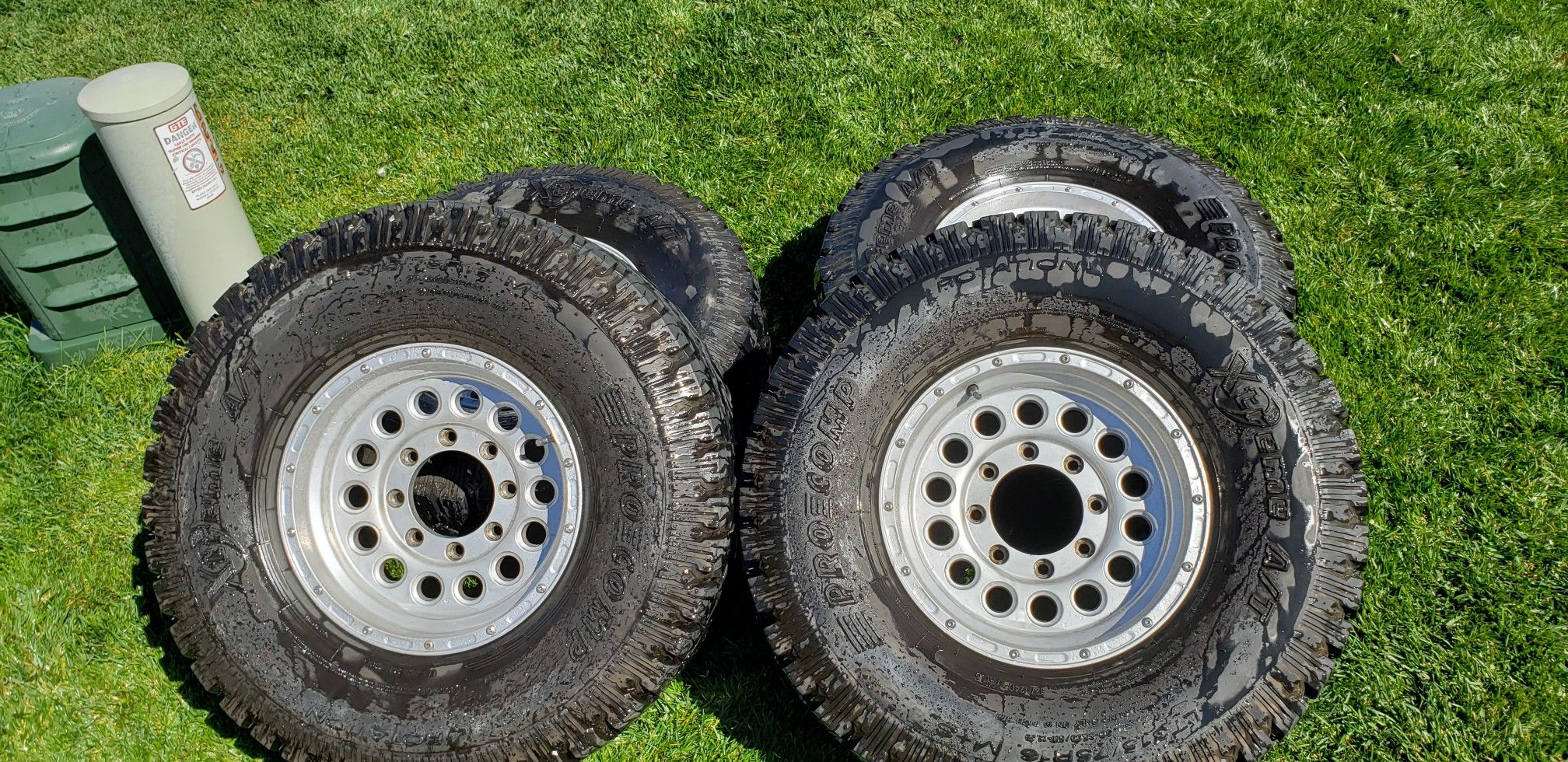 4 Pro Comp Extreme All Terrain tires. 315/75 R16 W/ aluminium 16 wheels