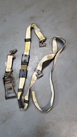 E-track wheel straps for enclosed trailers