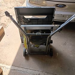 Ryobi 10-inch Table Saw with a folding or rolling stand. 
