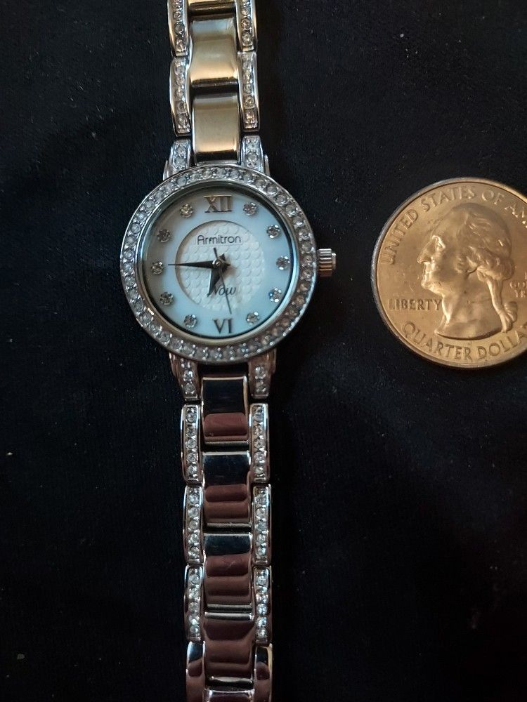 .WOMEN'S ARMITRON NOW ANALOG DRESS WATCH SILVER TONE BAND ROUND 75/4087SV-H12