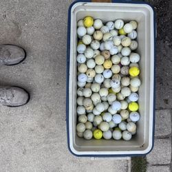 Golf balls and cooler  probably 2 to 3 hundred balls in there