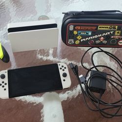 Nintendo Switch Oled With Two Joy Cons, Joy Con Grip And Mario kart Carrying Case