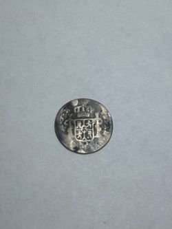 Spanish Colonial Silver Real coin.