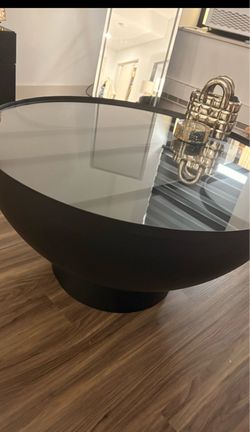 Black round glass top coffee table