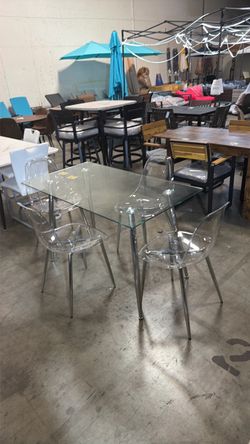 On sale!! New 51" X 27”  Glass Dining Table and 4 Clear Dining Chairs. Silver legs