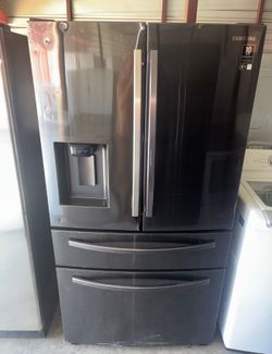 Dark Stainless Steel Samsung Refrigerator And Freezer