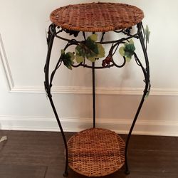 Decorative plant stand w/ 2 wicker shelves, metal frame featuring leaf accents 28” T x 12W