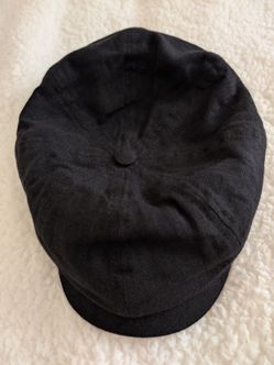 A men's linen hat complements a suit dress shirt