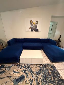 Blue sectional with two rotating chairs