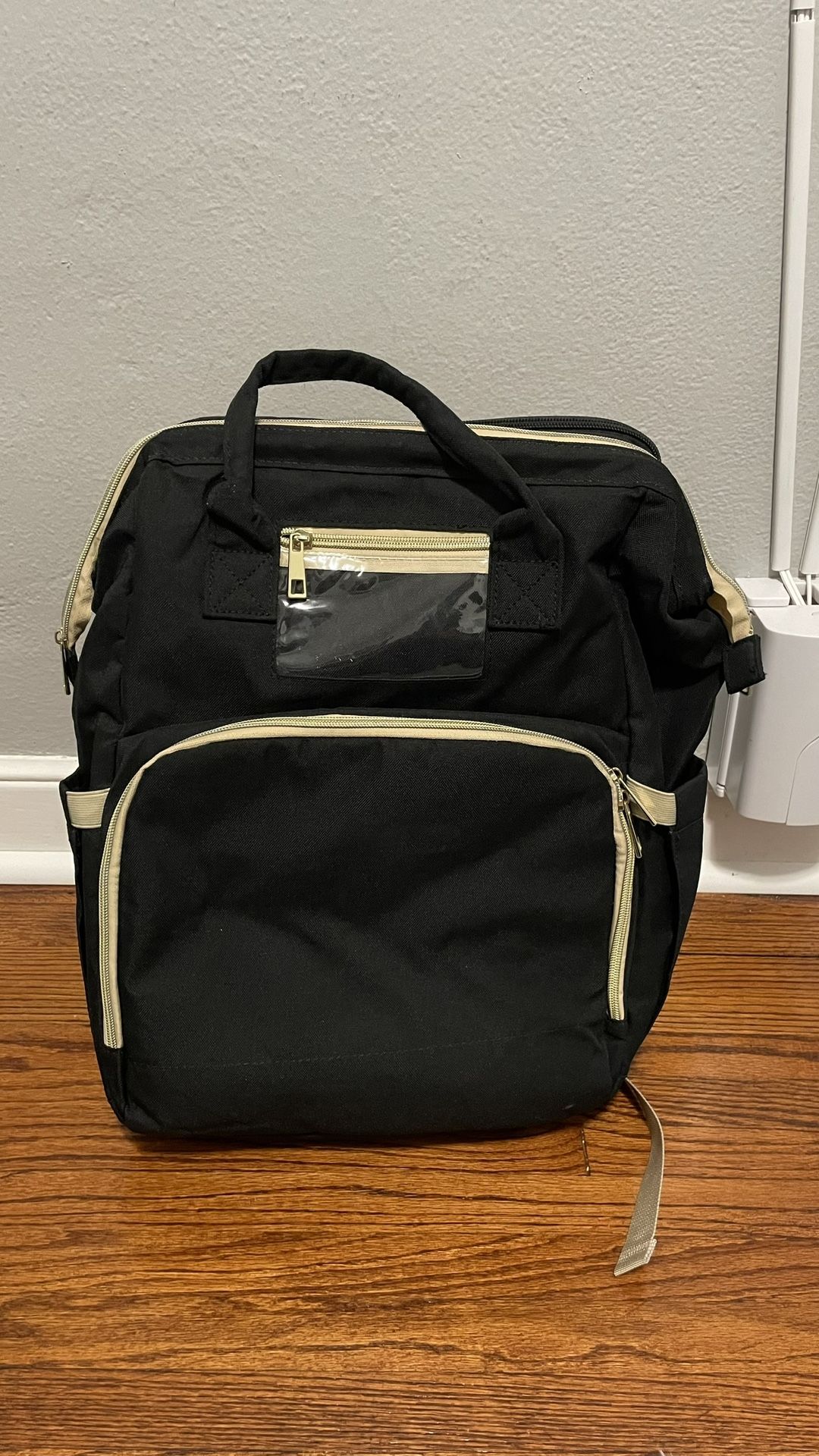 Diaper bag with changing station