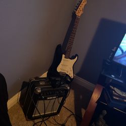 Electric Guitar With Amp And Headphones 