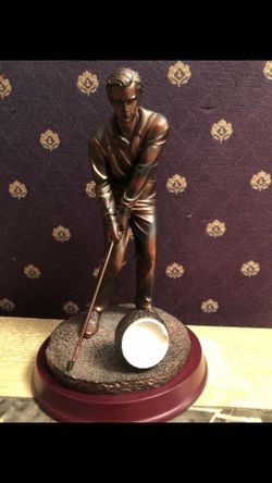 Bronze-colored man swinging a golf club 10”H 6”W