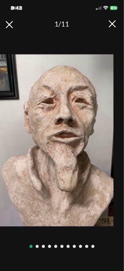 antique Rock life size Older Asian monk looking old Man
