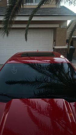 Red Car with Sunroof and Tinted Windows