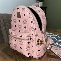 Small pink mcm online backpack