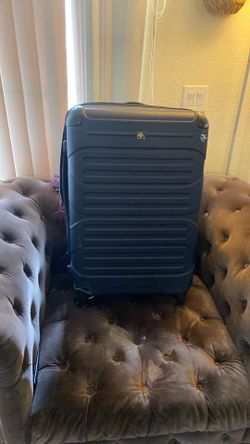 Midnight blue traveling suitcase