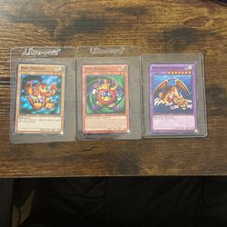 Baby Dragon, Time Wizard And Thousand Dragon Yu-Gi-Oh Cards.