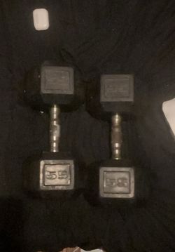 Two 55 pound dumbbells