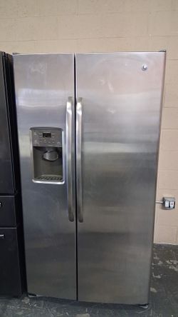 Like new GE side by side stainless steel refrigerator
