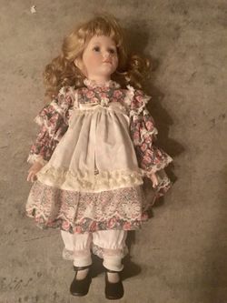Blonde Caucasian Porcelain Doll Dressed In Petticoat afire