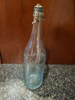 Wilson Rockford IL 12" tall vintage clear bottle