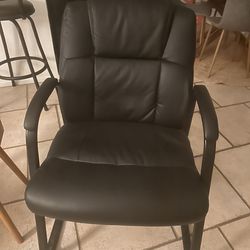 2 Black Leather Chairs.
