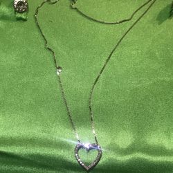 White gold chain and white gold pendant with diamonds. Real gold and real diamonds.