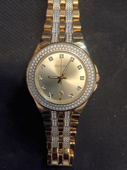 Gold men's Bulova watch