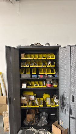 Storage cabinet with miscellaneous tire items