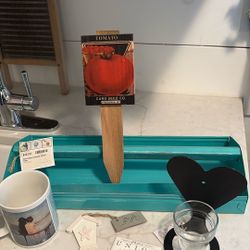 6 Items- Rustic Metal Tote, Leanin’ Tree Mug, Wood Tomato Stake Etc. 