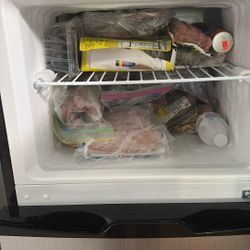 Studio apartment size refrigerator with freezer