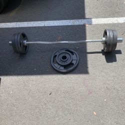Olympic Bar With 90 Pounds Of Iron Weights
