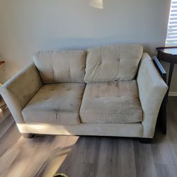 Small Green Couch needs cleaning