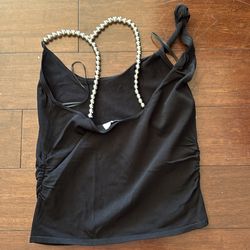 Brand Zara black shoet blouse with silver beads in the back.
