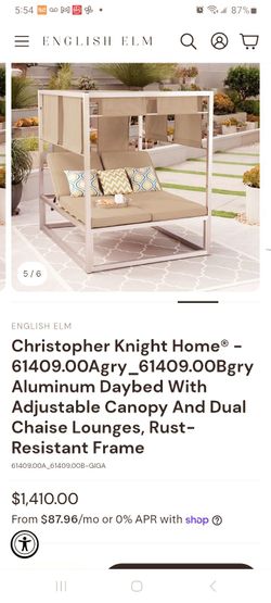 Orange aluminum outdoor daybed with adjustable shades