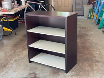 Shiny dark shelving unit