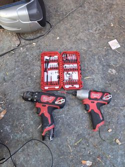 Milwaukee 12 v drills with some drill bits